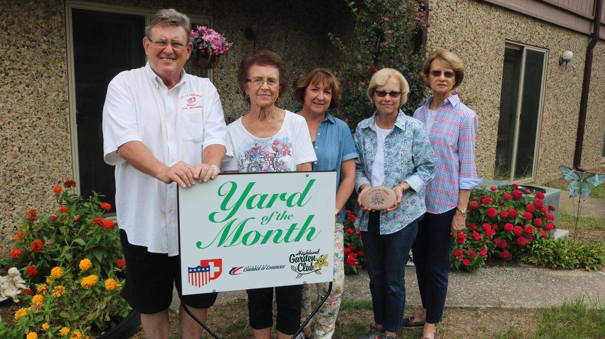 Marilyn Fickbohm is presented with the Yard of the Month award for the month of September for her yard at  1501 Poplar St. in Highland. From left to right is Mayor Joe Michaelis, Fickbohm, Highland Garden Club Yard of the Month Chairs, Barbara Stallard and Pat White, and Garden Club President Kay Gaines. The award is sponsored by the city, the Garden Club and the Highland Chamber of Commerce.