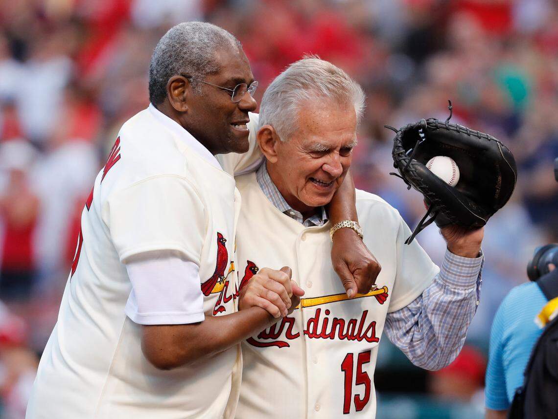 FILE - In this May 17, 2017, file photo, Bob Gibson, left, and Tim McCarver, members of the St. Louis Cardinals’ 1967 World Series champion team, take part in a ceremony honoring the 50th anniversary of the victory, before a baseball game between the Cardinals and the Boston Red Sox in St. Louis. Gibson, the dominating pitcher who won a record seven consecutive World Series starts and set a modern standard for excellence when he finished the 1968 season with a 1.12 ERA, died Friday, Oct. 2, 2020. He was 84. (AP Photo/Jeff Roberson, File)