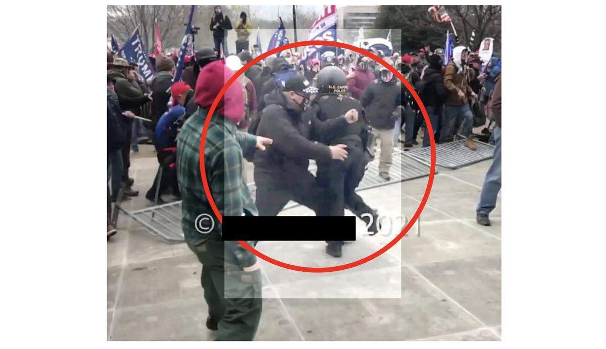 Screenshot showing Shane Jason Woods, 47, of Auburn ramming his body into a U.S. Capitol Police officer on Jan. 6, 2021. Woods has pleaded guilty to assaulting the officer and striking a photographer. He received a sentence of 4.5 years for these cases. Woods is facing a first-degree murder charge in connection with the death of a woman in Sangamon County.