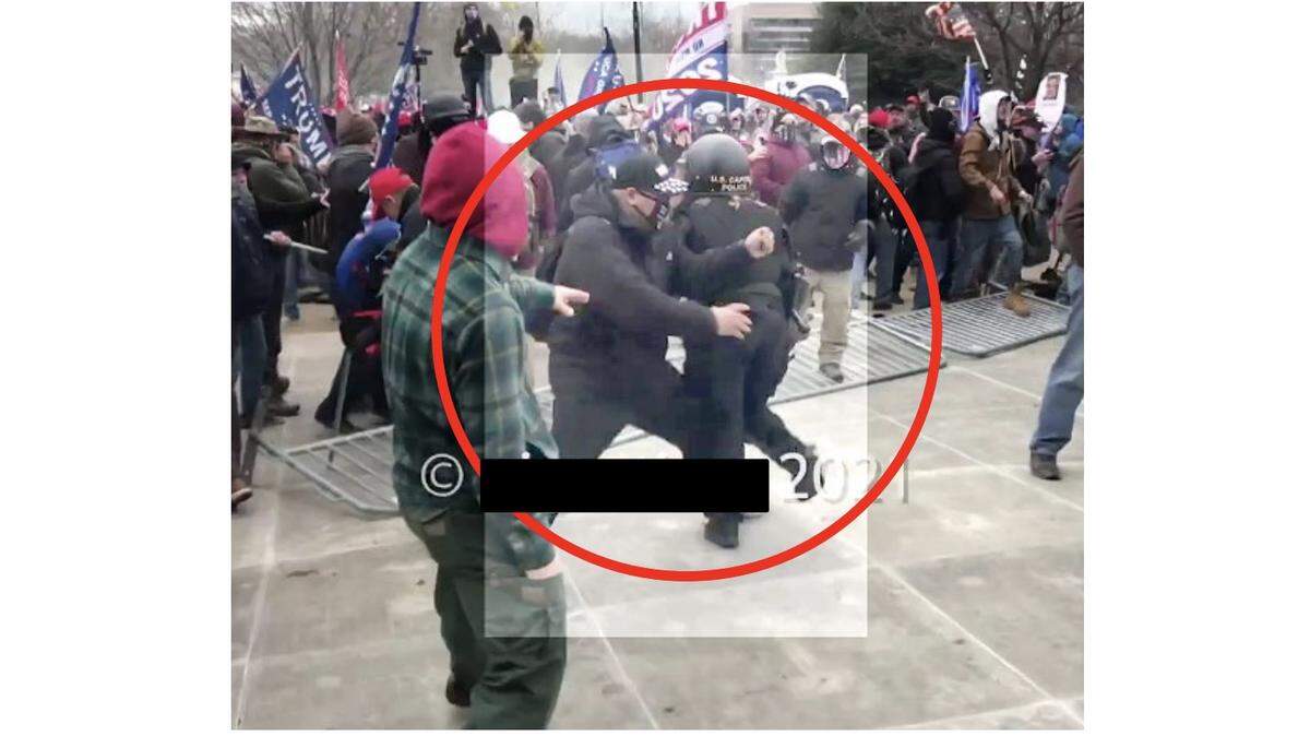 Screenshot showing Shane Jason Woods, 47, of Auburn ramming his body into a U.S. Capitol Police officer on Jan. 6, 2021. Woods has pleaded guilty to assaulting the officer and striking a photographer. He received a sentence of 4.5 years for these cases. Woods is facing a first-degree murder charge in connection with the death of a woman in Sangamon County.