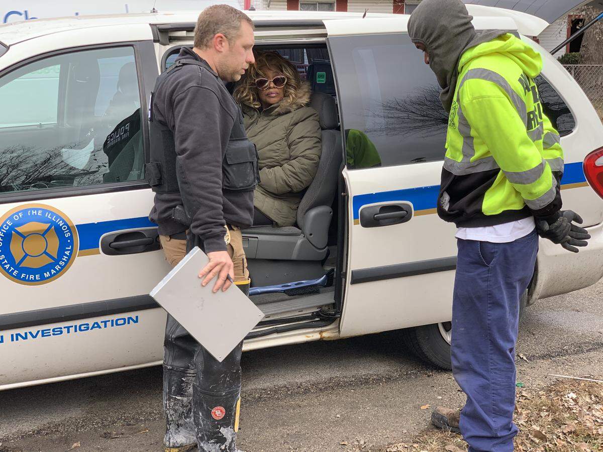 Alorton Mayor JoAnn Reed’s house was destroyed by a fire early Monday morning, but she managed to get out of the house safely. She’s pictured here sitting inside an Illinois State Fire Marshal van outside her home.