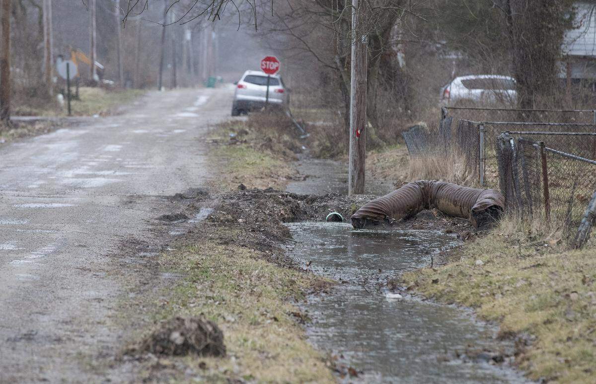 An old drain pipe rests right next to the new one that was installed on North 80th Street in Centreville.