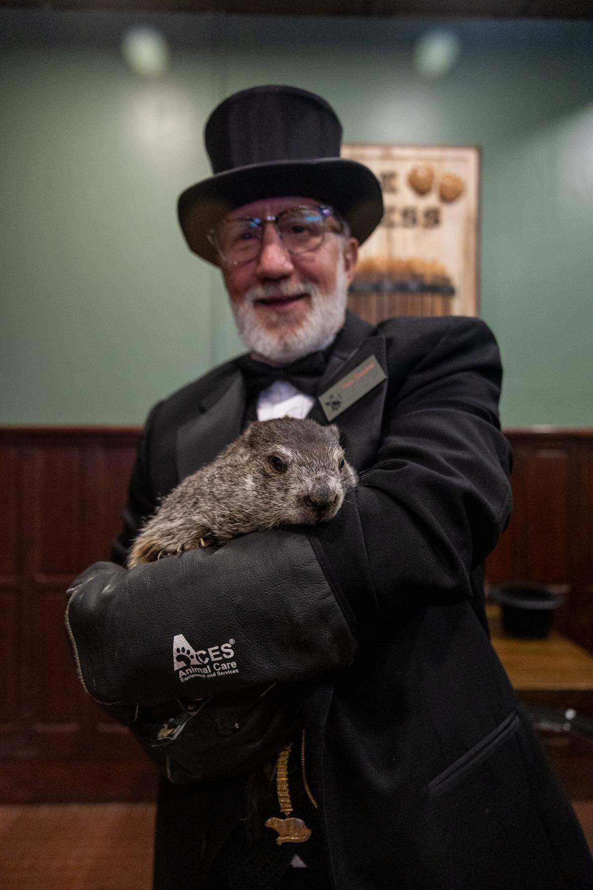 Tom Dunkel, president of the Punxsutawney Groundhog Club carries Punxsutawney Phil in The Press Cider and Craft Beverage Tap House on Saturday, Jan. 17, 2026 in State College.
