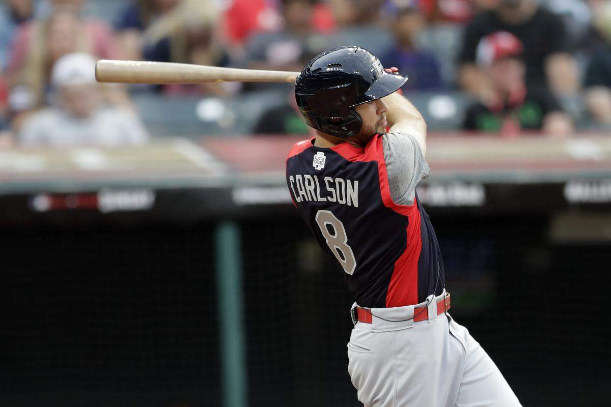 Dylan Carlson, of the St. Louis Cardinals, hits an RBI-single during the fourth inning of the MLB All-Star Futures baseball Game, Sunday, July 7, 2019, in Cleveland. The MLB baseball All-Star Game is to be played Tuesday. (AP Photo/Tony Dejak)