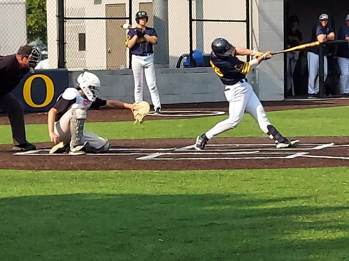 O’Fallon senior catcher Will Millard rips a base hit to left field during a nonconference game against visiting Highland on Wednesday, May 17, at Blazier Field. The Panthers ultimately rallied for a 3-2 victory.