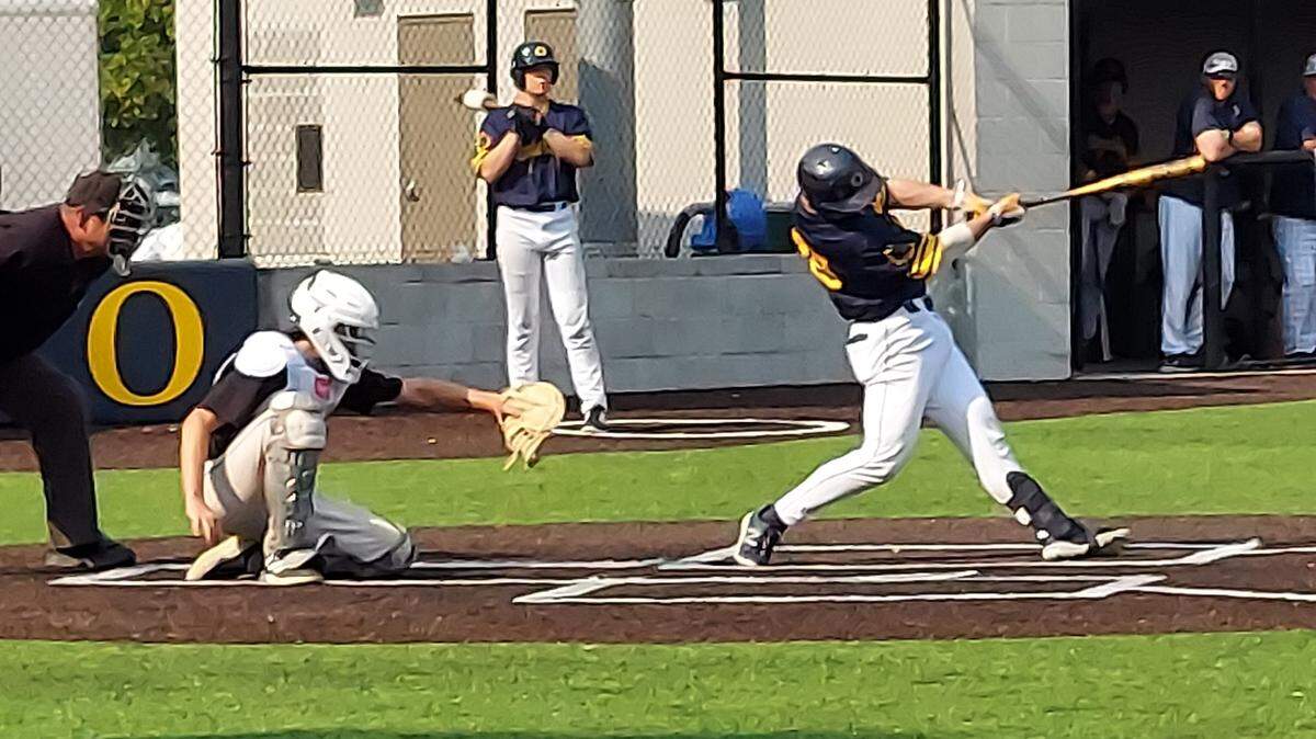 O’Fallon senior catcher Will Millard rips a base hit to left field during a nonconference game against visiting Highland on Wednesday, May 17, at Blazier Field. The Panthers ultimately rallied for a 3-2 victory.
