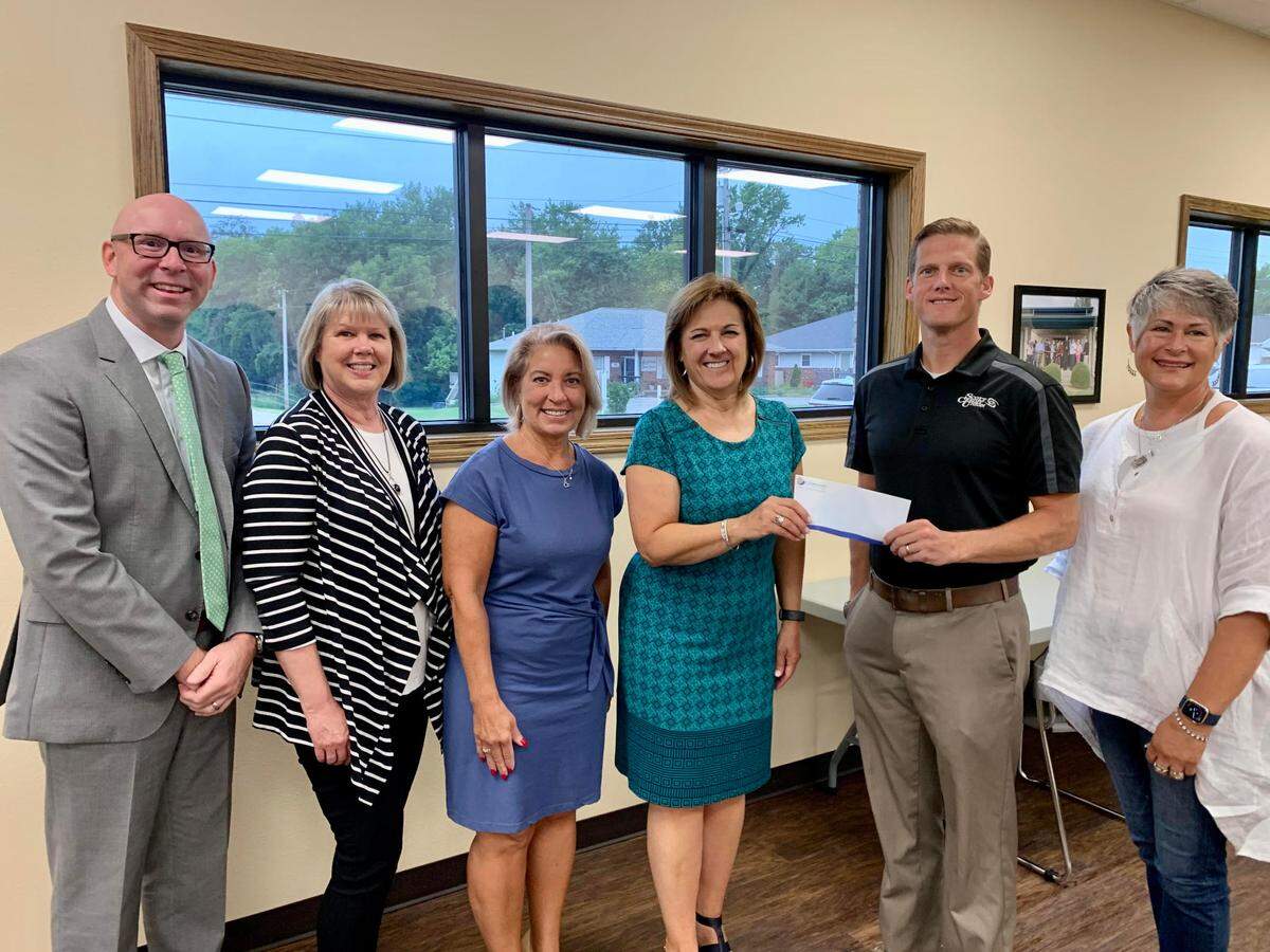 Representatives of Busey Bank were in attendance at the Highland Area Community Foundation’s quarterly board meeting Aug. 16 to present their annual financial report. In addition, they presented The Foundation with a $2,500 check for sponsorship of this year’s banquet. From left, Busey Bank representatives Sean Callison, Carol Porter, Gail Washenko and Joann Barton present the check to Ryan Goodwin, Foundation president, and Shari Ammann, this year’s Grants Banquet chair. This will be the 17th year Busey Bank has sponsored the Foundation’s Grant Banquet.  This year’s event is scheduled for Tuesday, Oct. 11, at the Knights of Columbus Hall in Highland.