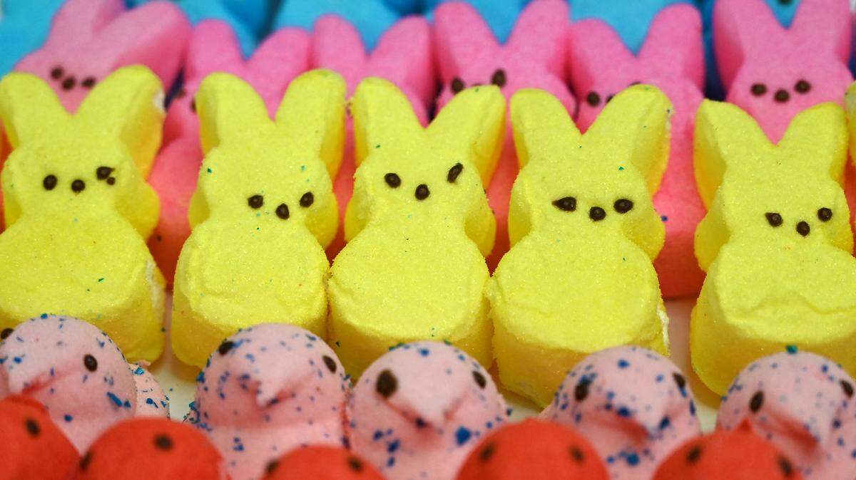 This illustration shows Peeps marshmallows laying on a table in Washington, DC on April 2, 2021. - The US-made confection produced by Just Born is back on the shelves for the 2021 Easter season after a hiatus on holiday-themed Peeps over the past year due to production issues during the pandemic. Peeps, which can be shaped into chicks, bunnies and other animals, are typically used to fill Easter baskets. (Photo by Eva HAMBACH / AFP) (Photo by EVA HAMBACH/AFP via Getty Images)