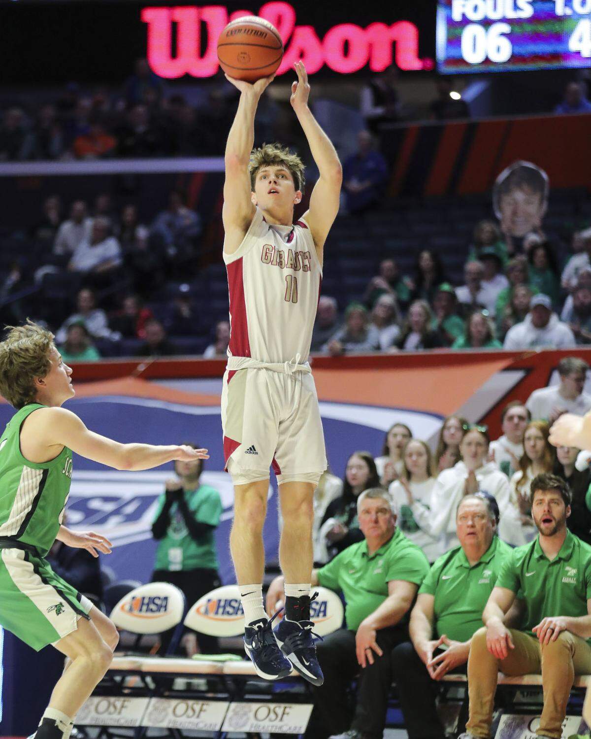 Gibault’s Kameron Hanvey hits a 3-pointer during Saturday’s IHSA Class 1A state championship game against Scales Mounds at the State Farm Center on the campus of the University of Illinois. Gibault ultimately prevailed 65-45 to claim the state title.