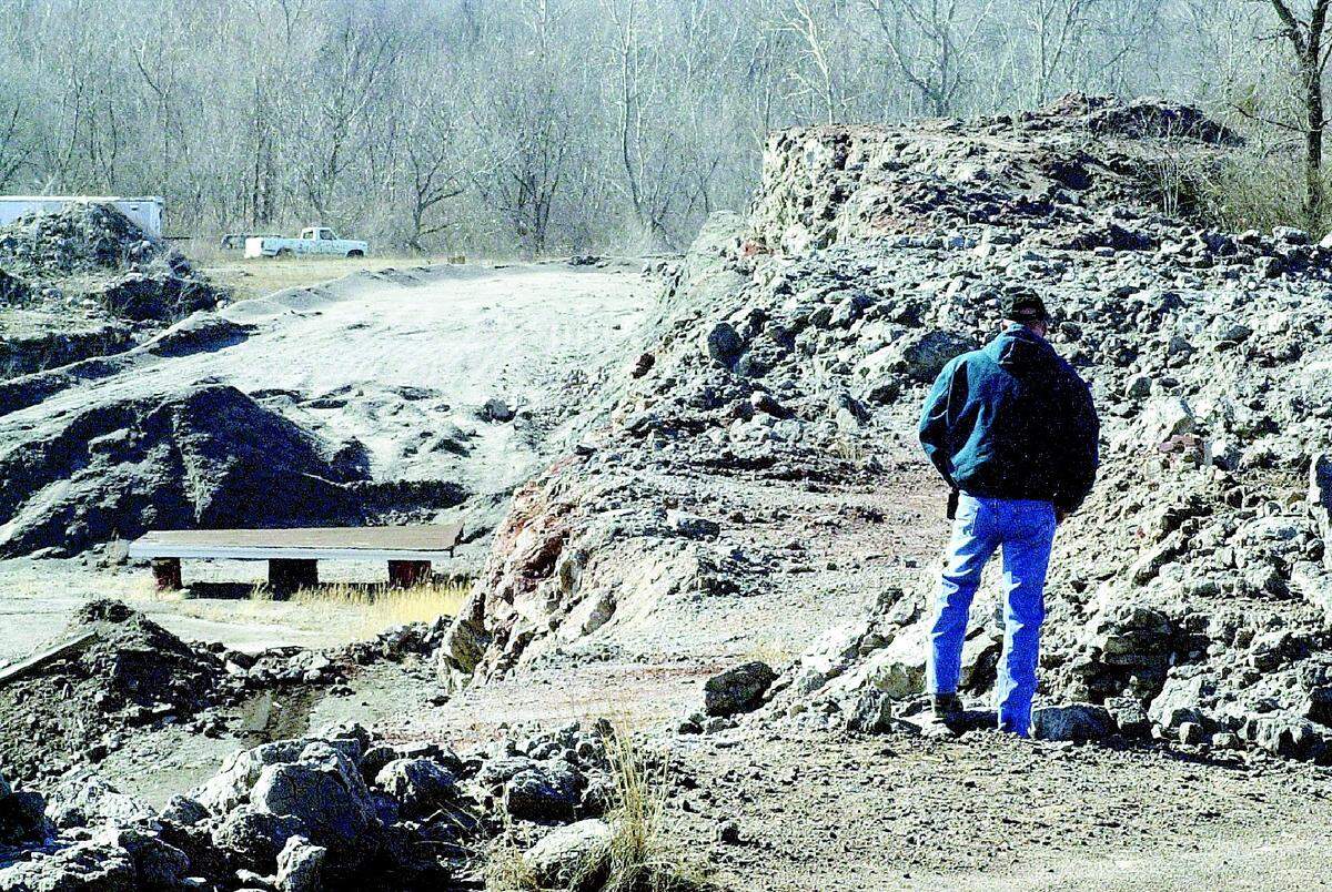 This Feb. 10, 2002 BND file photo shows Joe Laiben stands at the former Alcoa site in East St. Louis. Cleanup first began in 2001 but was not completed until 2016.