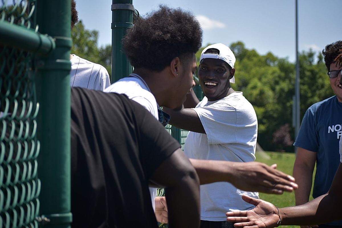 Kickball players talk during the Black Lives Matter charity tournament July 11, 2020, in Shiloh.