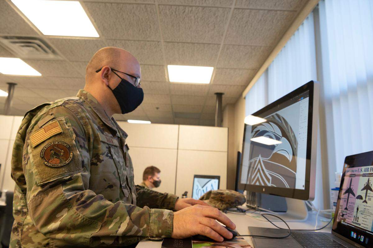 U.S. Air Force Senior Airman Michael A. Shaw, 375th Communications Support Squadron applications designer, works on an emblem redesign on Scott Air Force Base. Shaw and other application designers focus on visual layouts of applications and ensure things are not only intuitive, but also pleasing to the eye.