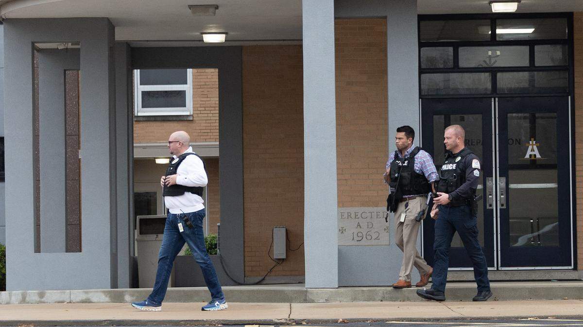Belleville police officers leave Althoff high school after a reported burglary Nov. 25.