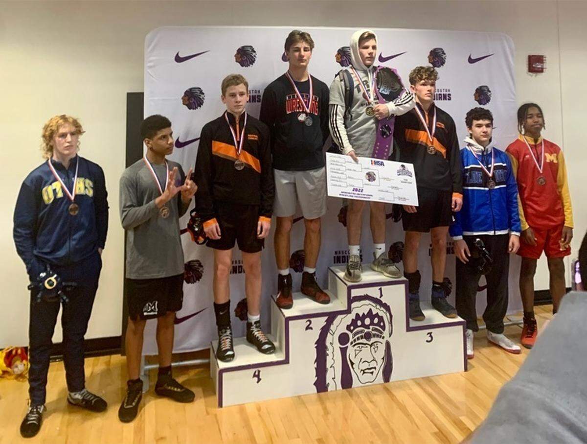 Highland sophomore wrestler Tyson Rakers stands on the podium with his second-place medal with 132-pound champion Colby Crouch of Triad following the Mascoutah Invitational. The other top eight finishers in the division included Vallen Thorpe of Normal Community in third place, Jaren Frankowiak of Normal Community in fourth place, Eli Roberts in fifth place, Jordan Sonon of Mascoutah in sixth place, followed by Jonathan Witzman of Murphysboro in seventh place and Kalib Schultz of O’Fallon in eighth place.
