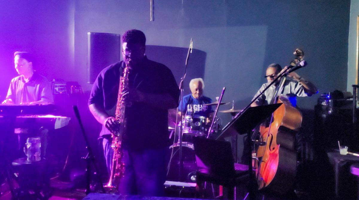 Saxophonist Kendrick Smith, originally from East St. Louis, performs with Tracer, a St. Louis-based jazz fusion band at Local Legends Listening Room in East St. Louis.