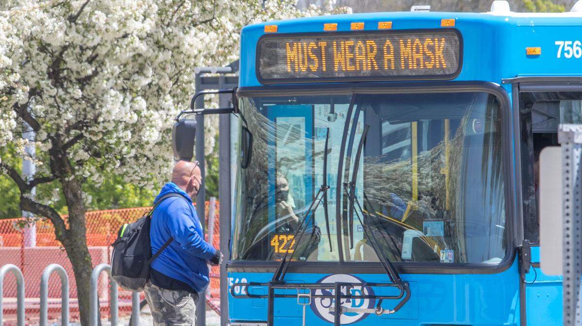 St. Clair County Transit District bus riders wait to get on a bus at the Belleville Transit Center. Masks will no longer be required on St. Louis regional public transportation, the area’s transit authority.