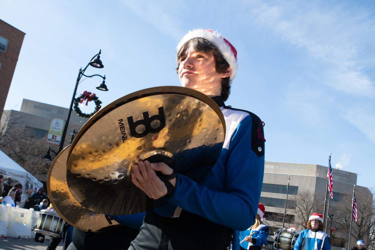 A Belleville East Lancer makes his way down Main Street during the annual Santa Parade.