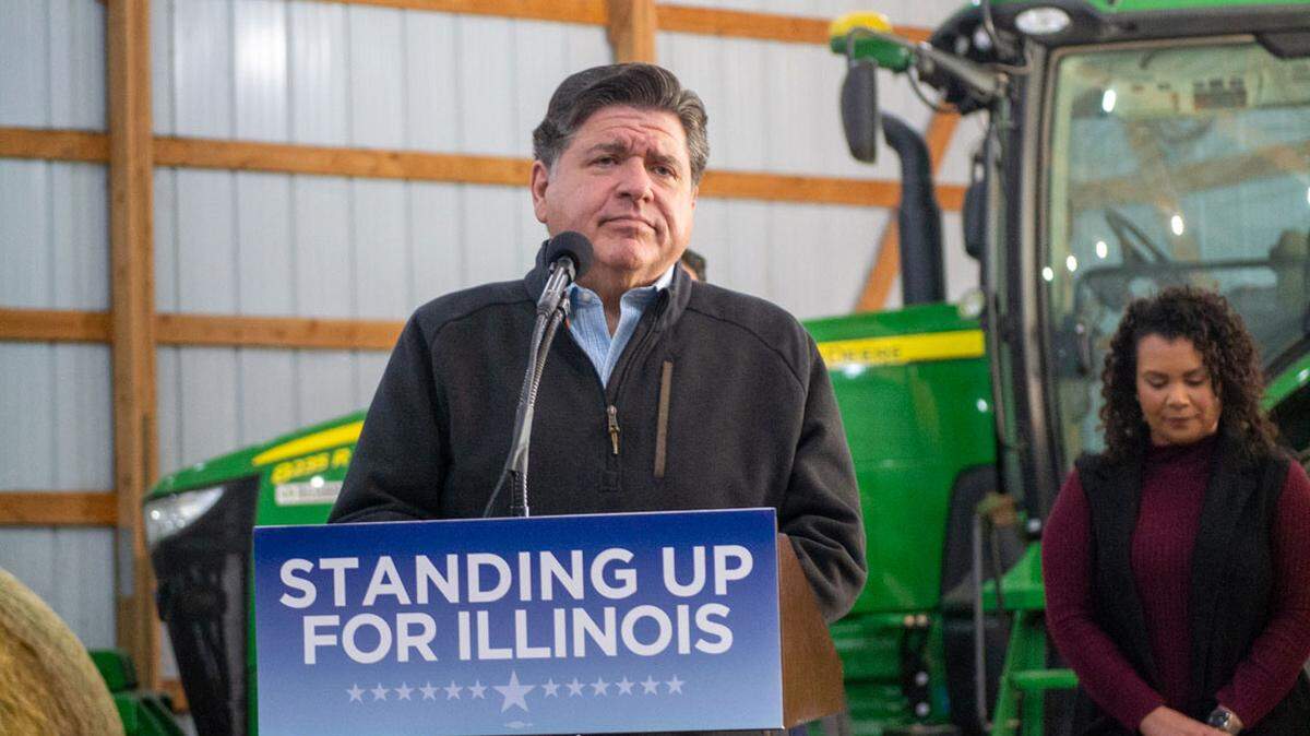 Gov. JB Pritzker listens to a question from a reporter during a news conference at a farm in Central Illinois on Oct. 29, 2025.