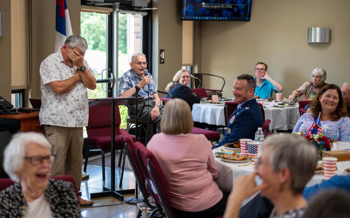 Clifford Good, World War II veteran, tells WWII stories to his friends and family during his 100th birthday celebratory luncheon Aug. 28 at the First Baptist Church in O’Fallon. Good flew nearly 50 combat missions: 33 missions over Italy, two missions over southern France, five missions over Greece, four missions over Germany, two missions over Bulgaria and one mission over Yugoslavia.