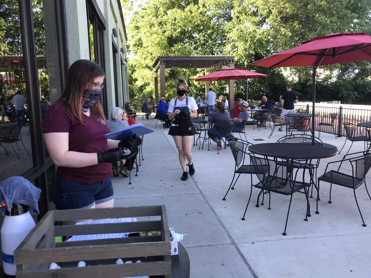 The patio was fully booked with reservations on Friday night at Old Herald Brewery & Distillery in Collinsville, beginning at 6 p.m.