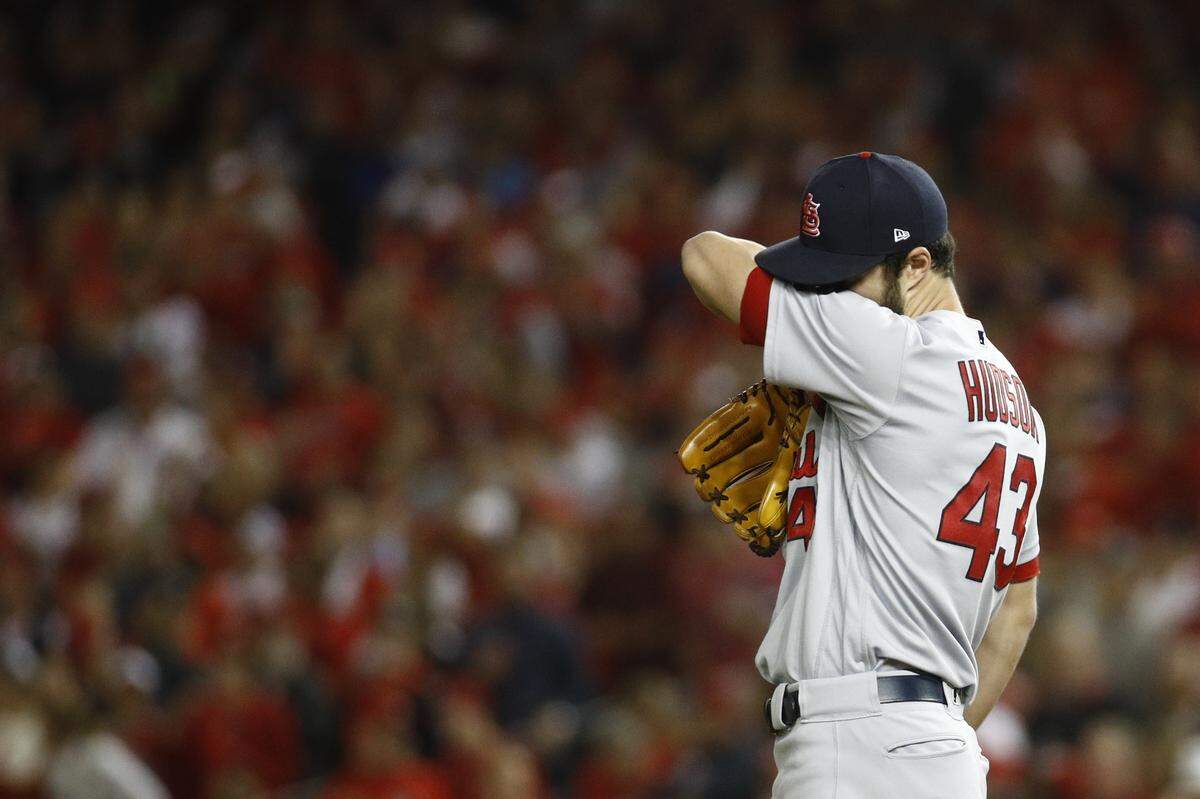 St. Louis Cardinals starting pitcher Dakota Hudson reacts during the first inning of Game 4 of the baseball National League Championship Series against the Washington Nationals Tuesday, Oct. 15, 2019, in Washington. (AP Photo/Patrick Semansky)