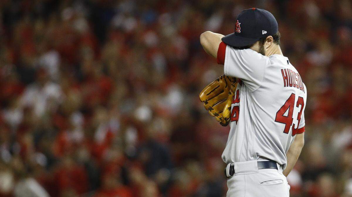 St. Louis Cardinals starting pitcher Dakota Hudson reacts during the first inning of Game 4 of the baseball National League Championship Series against the Washington Nationals Tuesday, Oct. 15, 2019, in Washington. (AP Photo/Patrick Semansky)