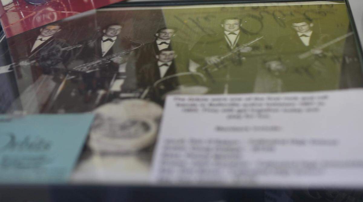 A photo of The Orbits displayed in the rock-and-roll exhibit held within the Belleville library.