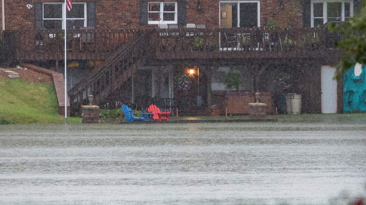 Water from Yoch Lake inside the Lake Lorraine neighborhood in Swansea, Illinois is creeping into a residence. Intense rains have dumped record levels of water on the St. Louis region.