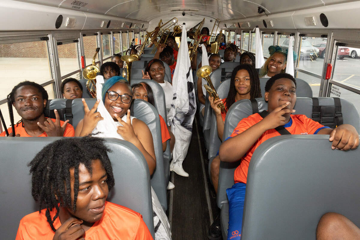 Members of the East St. Louis Senior High School band load inside of a bus to be taken to the starting point of the 618 Day/Juneteenth parade down State Street on June 18.