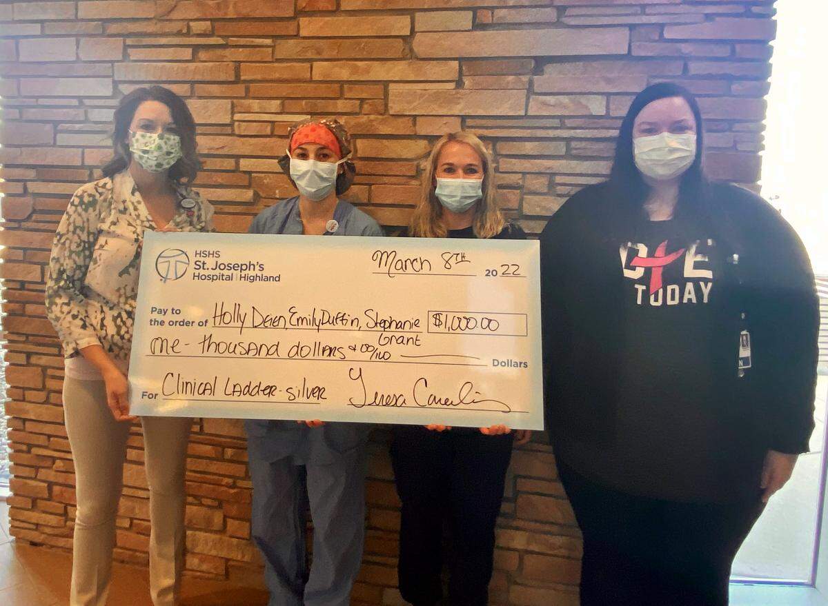 From left, Teresa Cornelius, HSHS St. Joseph’s Hospital’s chief nursing officer, recognizes Holly Deien, RN; Emily Duffin, RN; and Stephanie Grant, RN, for their achievement of the Silver Level award in the hospital’s Nursing Clinical Ladder program.