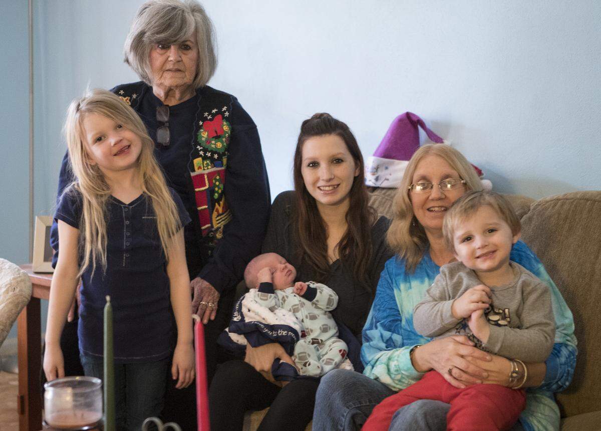 Theresa Jouett, center, poses with 3-week-old son Neal Allen and, clockwise from lower left, daughter Rayn Southers, 6, grandmother Judy Hensley, mother Sherry Brown and son Jackson Straughn, 2.