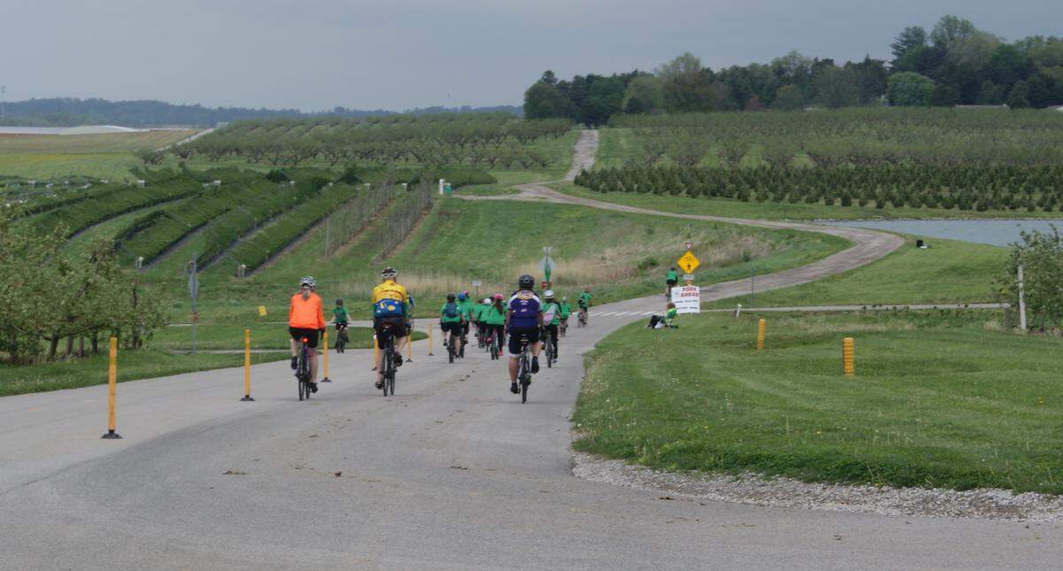Riders in the Tour de Belleville ride a section of the Orchard Loop Trail near Eckert’s.