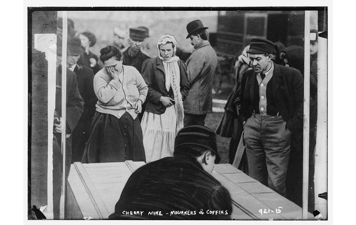 This 1909 photo shows mourners and coffins in the wake of the Cherry Mine Disaster. Eight days after the ordeal began, 21 survivors were brought to the surface, though two later died. In the end, 259 men and boys died.
