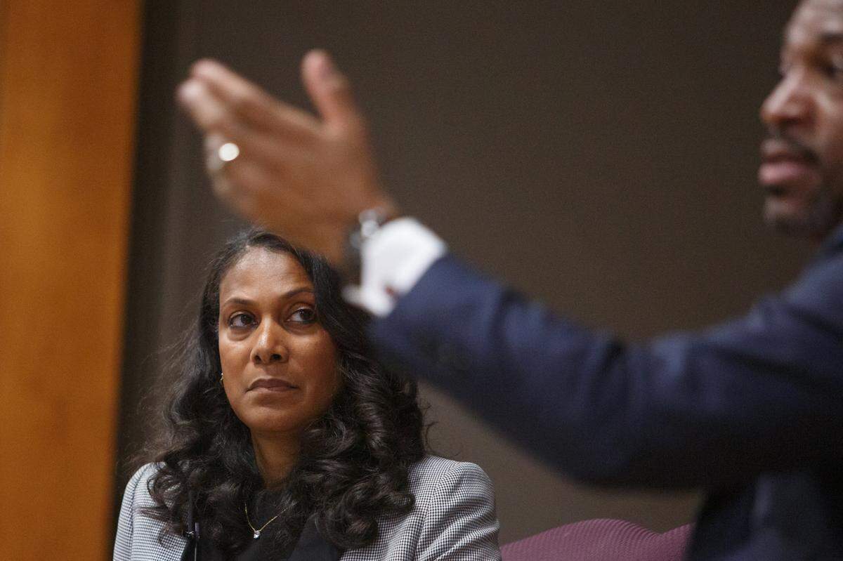 Dr. Tasha Green Cruzat, a US Navy veteran listens to Rev. Dr. Starsky Wilson President and CEO of the CHildren’s Defense, as he answers questions from the audience during the meeting on Childrens Advocate for Change Child Poverty Forum in Southern Illinois University, at Edwardsville East St. Louis Center