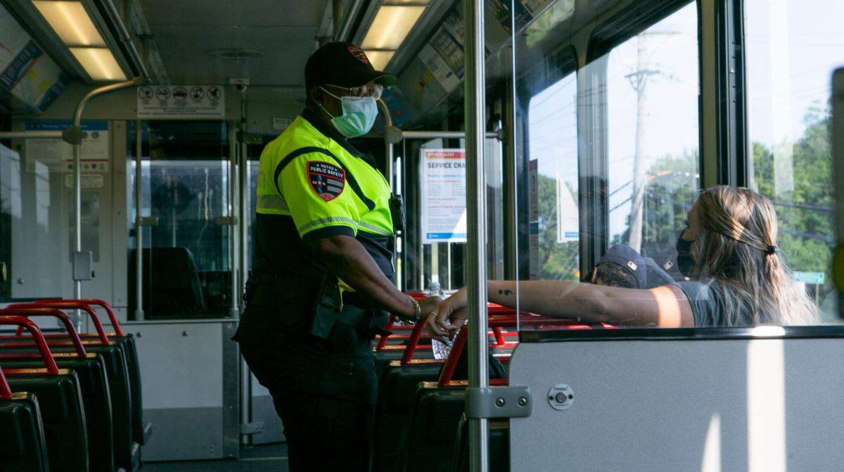 Transit security specialist, Sherri Coleman speaks with Emily Schwaegel, Behavorial Health Outreach coordinator for Chestnut Health Systems, while riding MetroLink. Schwaegel engages with riders who are experiencing symptoms of mental illness, present as homeless, or possess symptoms of intoxication and links them to necessary services after identifying their needs.