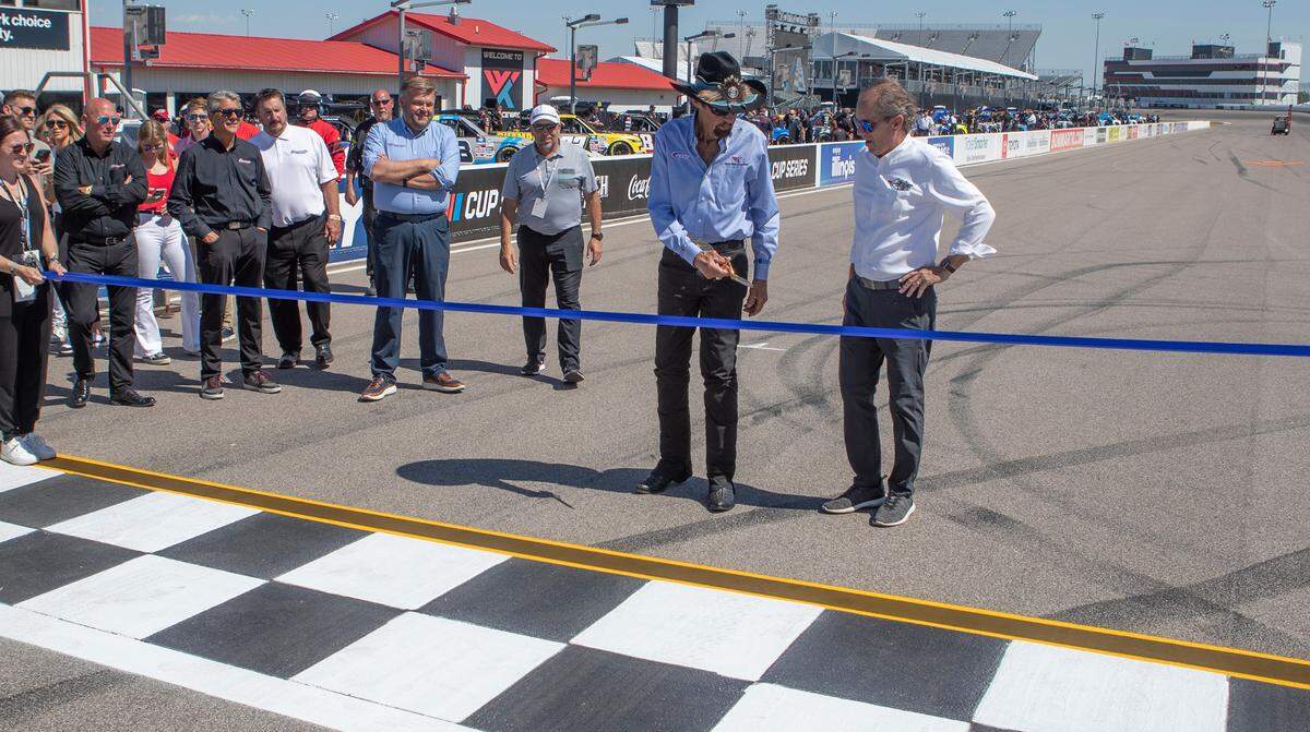 NASCAR legend Richard Petty and World Wide Technology Raceway owner Curtis Francois prepare to cut the ribbon for the NASCAR Cup Series Enjoy Illinois 300 that will be held on Sunday.