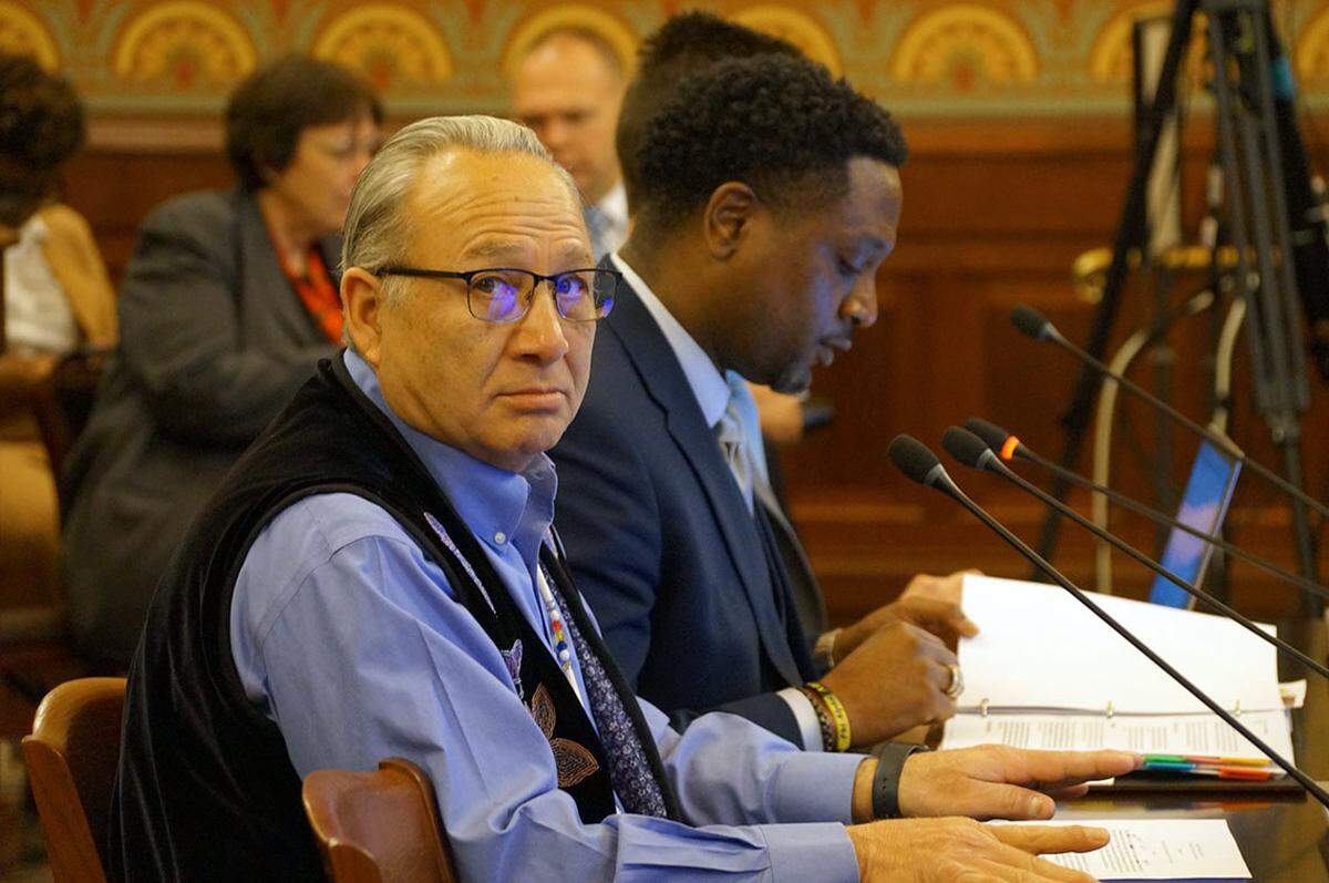 Joseph “Zeke” Rupnick, tribal chairman of the Prairie Band Potawatomi Nation, speaks at a committee hearing at the Illinois Capitol last year alongside state Rep. Maurice West, D-Rockford. West convenes a Native American working group to inform legislation at the Illinois Capitol.