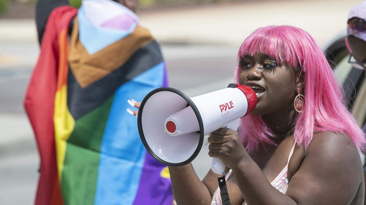 Nikki Hughes, 20, of Belleville leads a Pride and Black Lives Matter rally on Wednesday in Downtown Belleville. This month is usually when Pride events take place across the nation. This year, COVID-19 has canceled many of those events.
