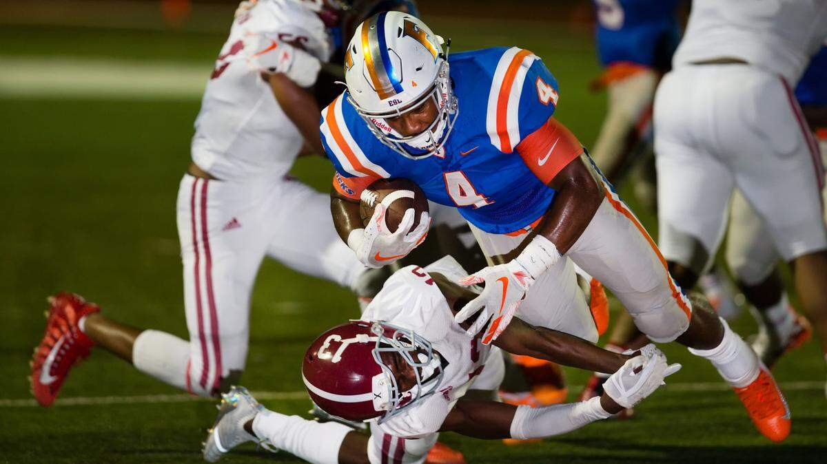  East St. Louis DeMonta Witherspoon  runs in for the touch down in the first quarter during Saturday’s game at Clyde Jordan Stadium.

