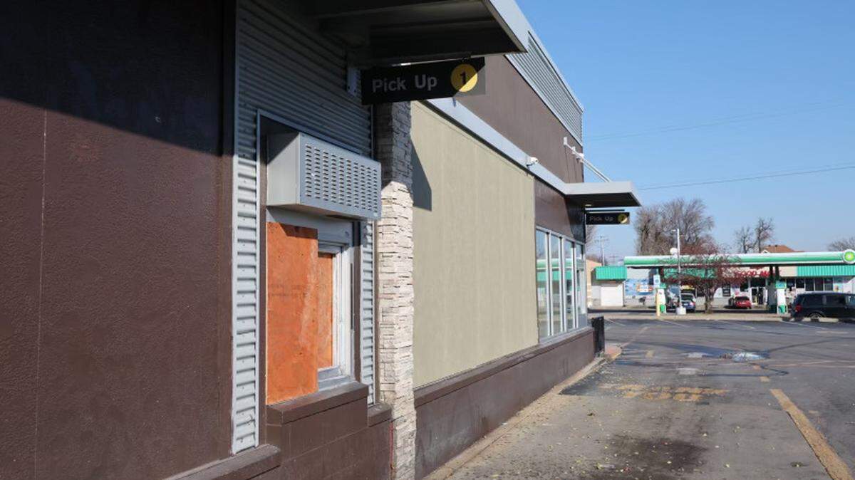 A drive-thru window remained boarded up Wednesday at the McDonald’s restaurant at the intersection of 25th and State streets in East St. Louis where a woman was fatally shot Monday night.
