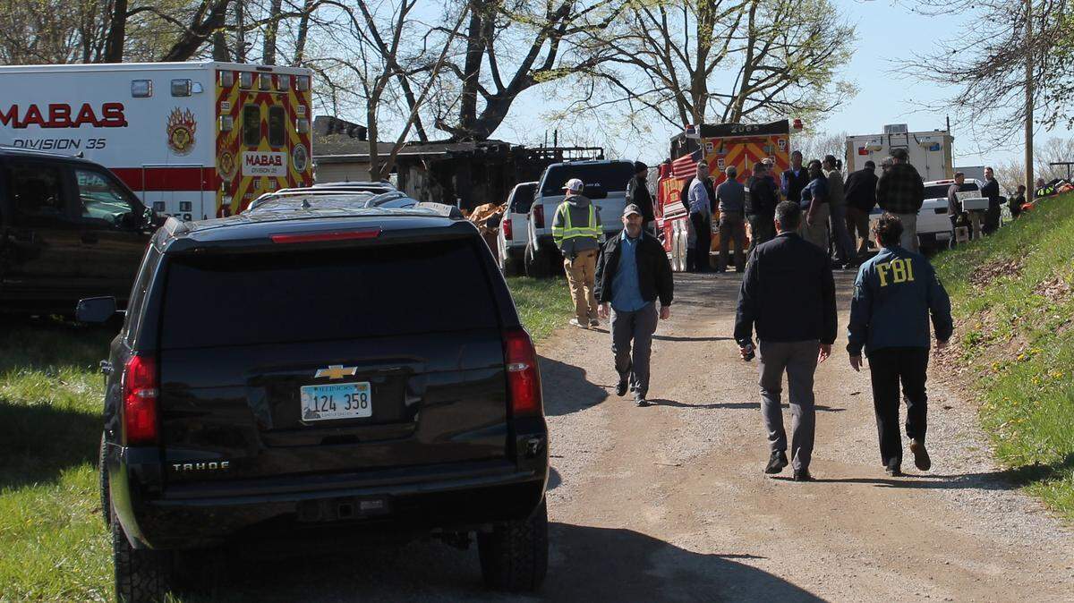 FBI agents arrive at a home in the 8000 block of Kirsch Road near Troy after an explosion and fire led to the deaths of three on the evening of Sunday, April 5.