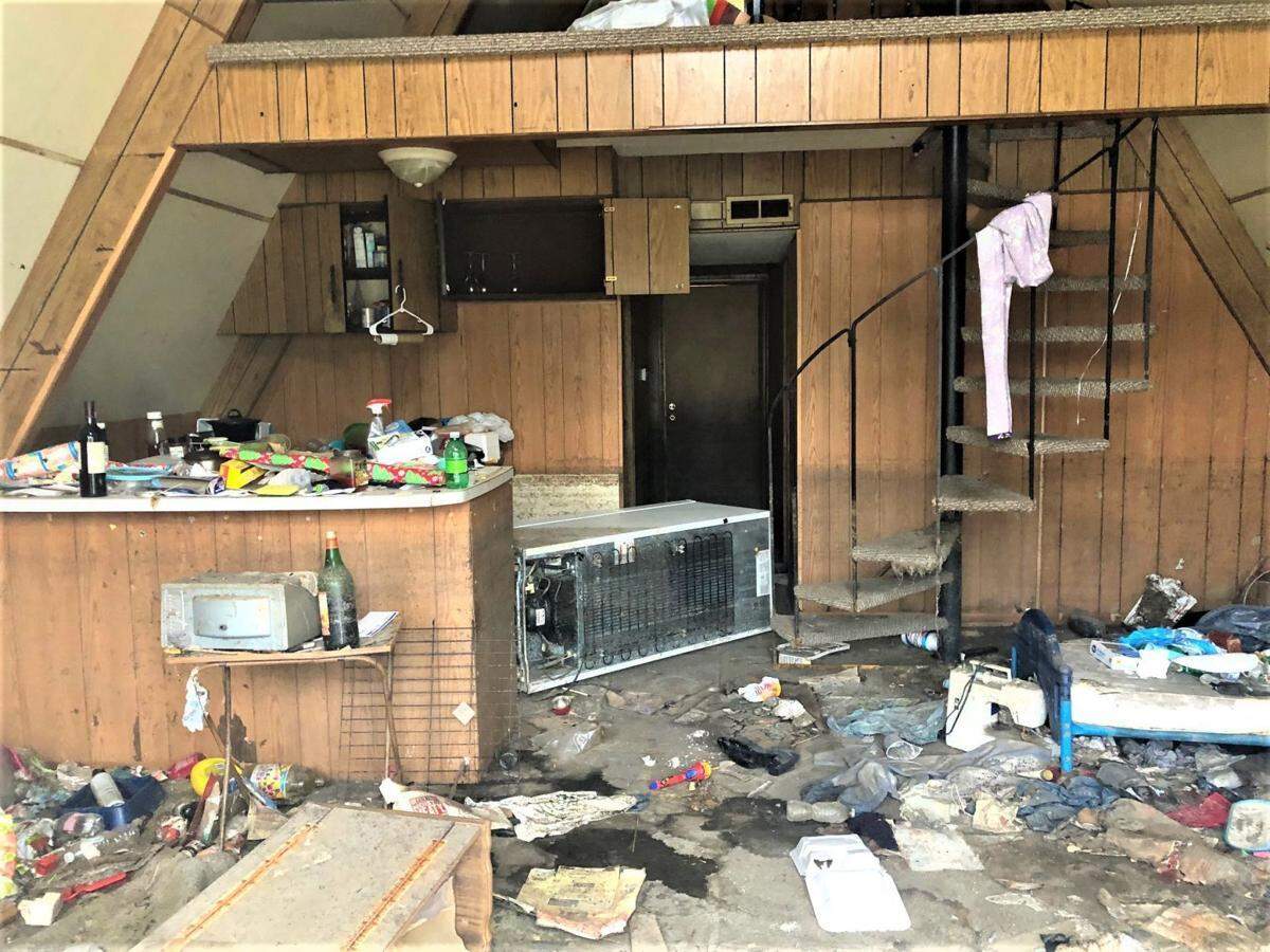When floodwaters forced residents out of several trailers and A-frame homes in East Cape Girardeau, Illinois, this summer, some residents left items behind in the rush to get out of town. This home has since been condemned by the village.