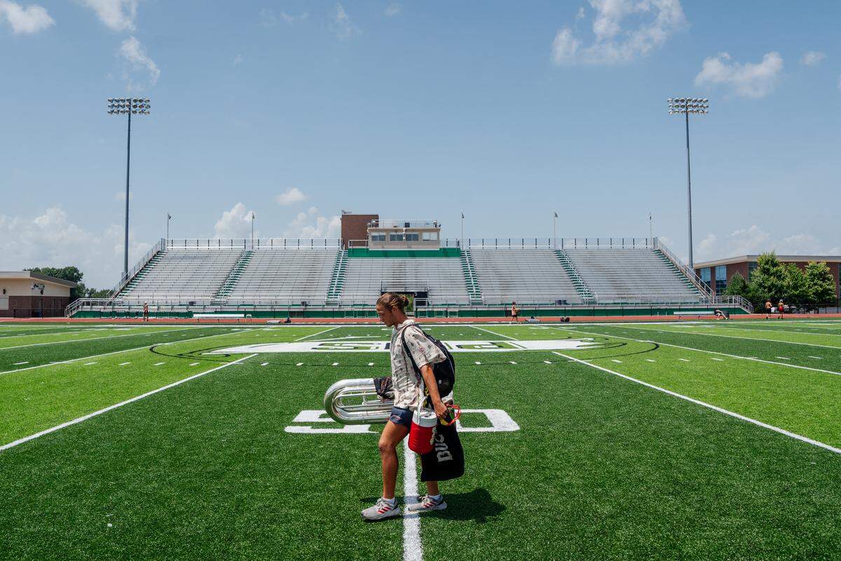 Boston Crusaders contra player Jackson Mettey, 21, of Fayetteville, Arkansas, walks to rehearsal at Pattonville High School on Tuesday, July 22, 2025, in Maryland Heights.