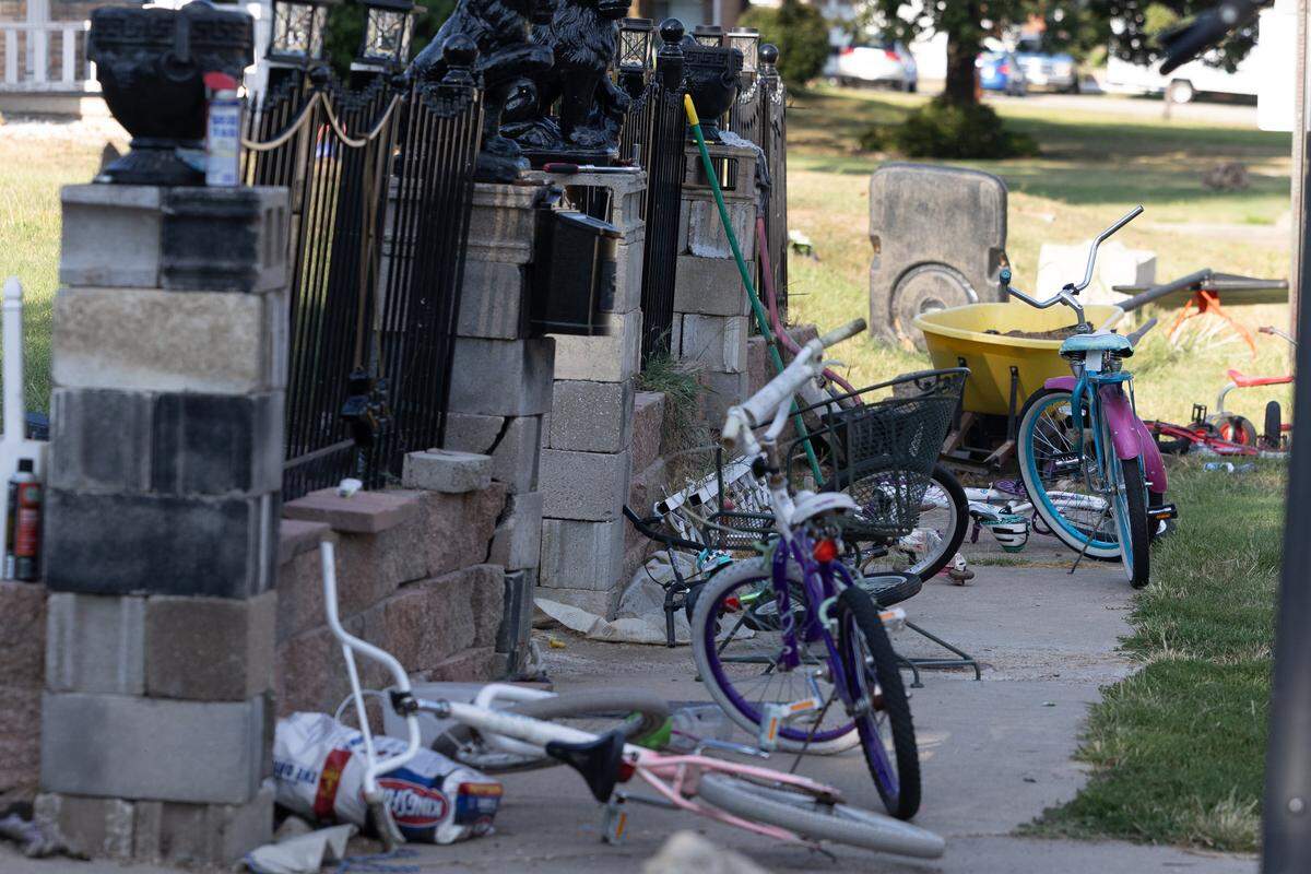 More than a dozen bicycles are strewn around the yard and down the sidewalk at 411 S. 19th St. in Belleville on a recent weekday. City officials have ordered the homeowner to clean up his property.