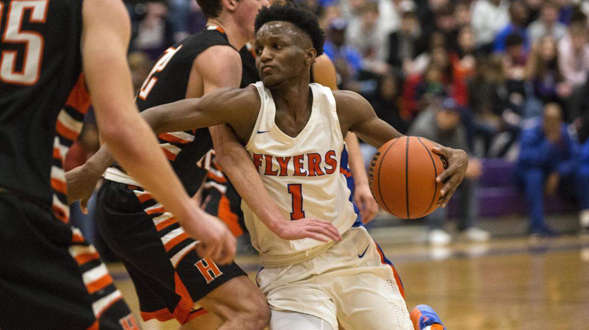 Flyer’s Jashawn Anderson drives to the basket during game 1 of the IHSA 3A Mascoutah Sectional basketball game Tuesday night in Mascoutah. Photo: Chris Johns
