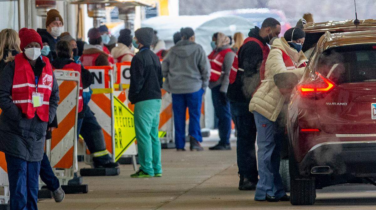 Cars pull up for COVID-19 vaccinations at Belle-Clair Fairgrounds in Belleville on Monday, the first day for a drive-thru clinic operated by St. Clair County agencies with help from the National Guard. For now, only people 75 and older are eligible.