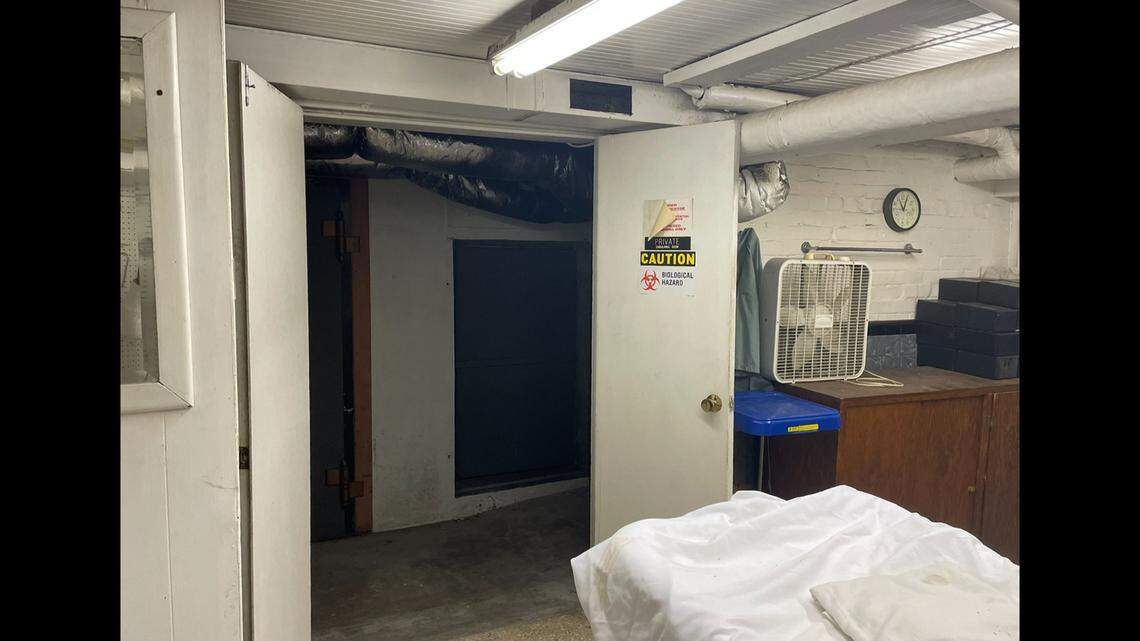 A doorway is pictured in what was once the embalming room of the Moran Queen-Boggs Funeral Home in Centralia. Behind it, a visitor last week found a hidden nook behind two levels of steel plates, which covered three human legs that were neatly wrapped and dated to the 1960s.