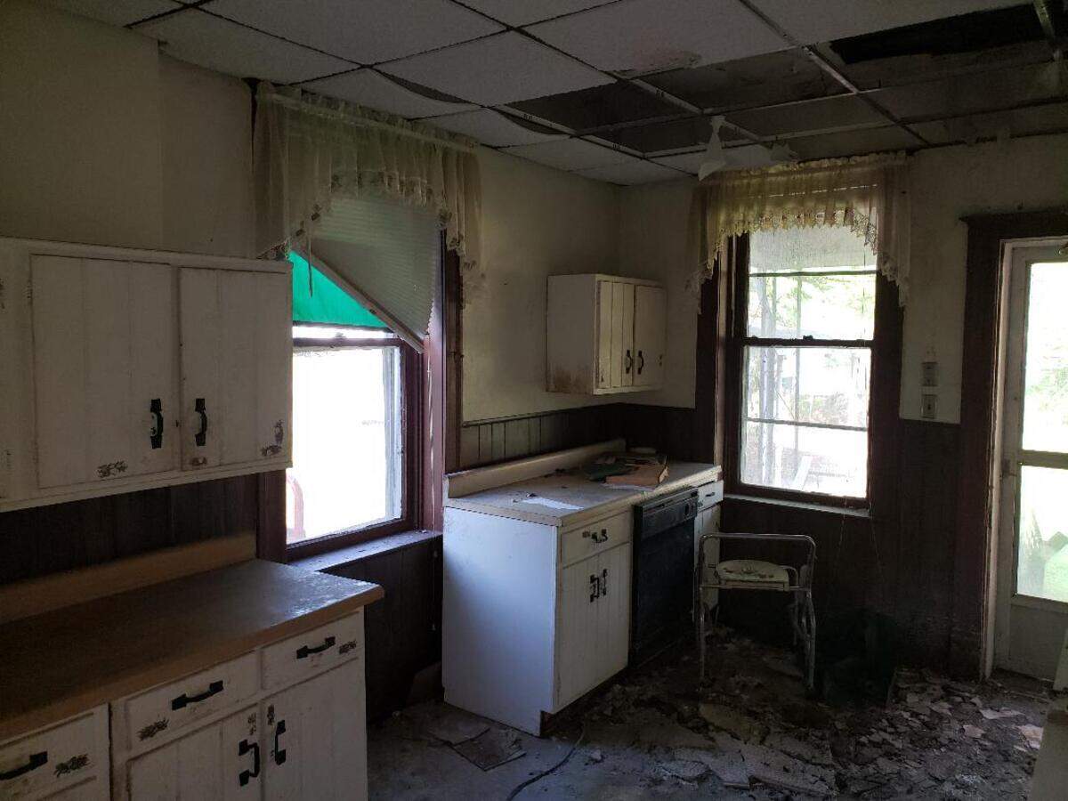 This “before” photo shows the kitchen of the home at 313 S. Ninth St. in Belleville. It has been gutted and renovated by Belleville Community Development Corp.