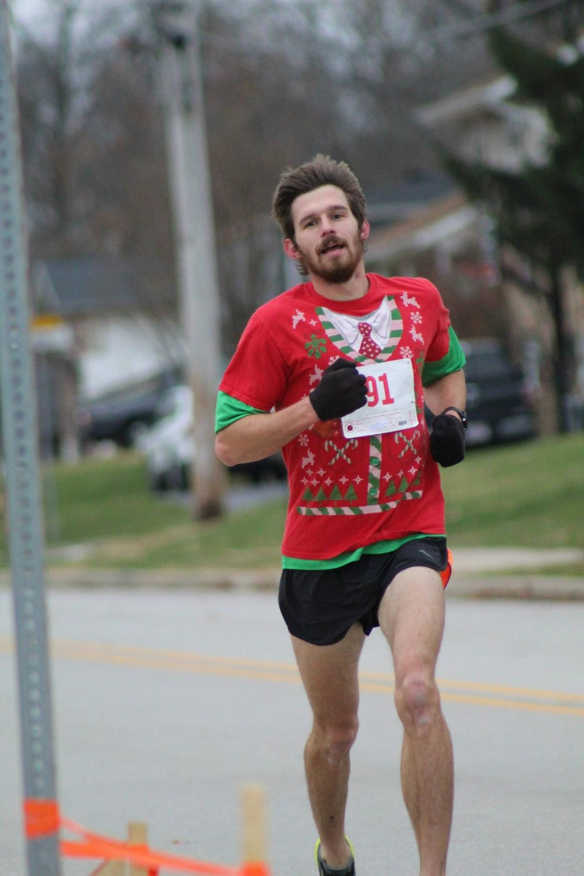 A runner participates in the annual Holiday Hilltop 5K Run/Walk in Shiloh. Event Director Neil Jansen said over $280,000 has been raised during the past 10 years to benefit a young person battling a challenging medical condition.