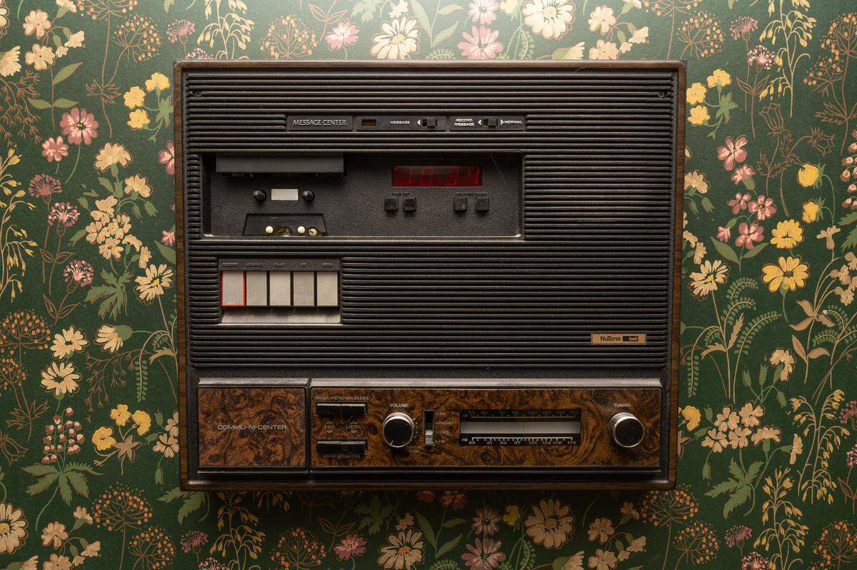 Vintage intercom and messaging machines are present in most rooms of the home.